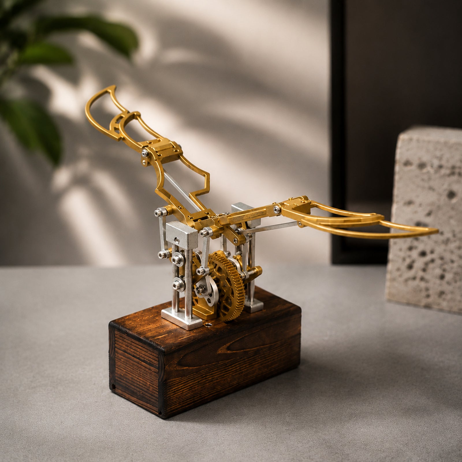 Gold Kinetic Angel Wings Sculpture in a warm modern interior